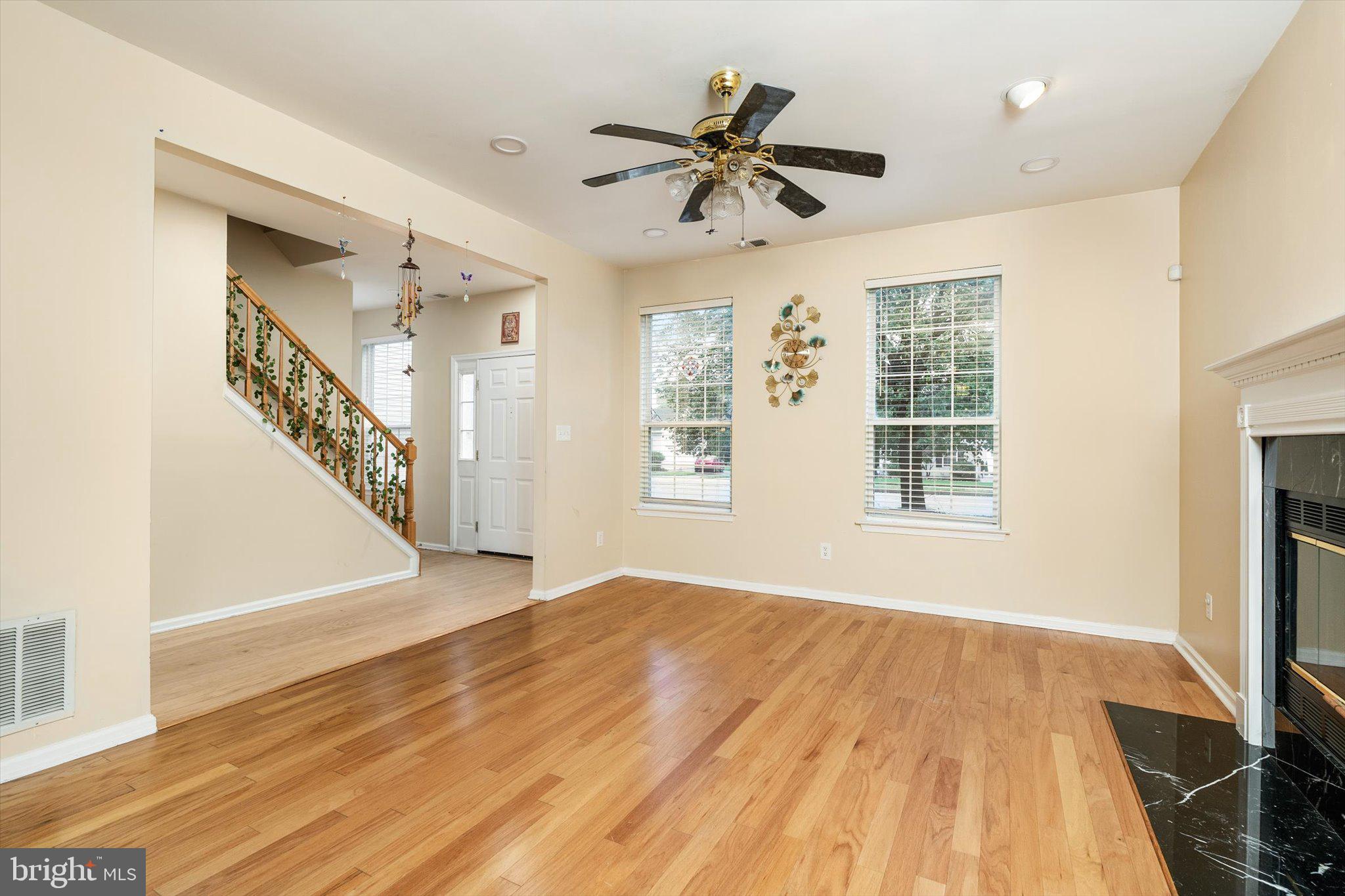 410 Denow Road Pennington, NJ 08534 - Photo 10 of 29 a view of an empty room with wooden floor and a window