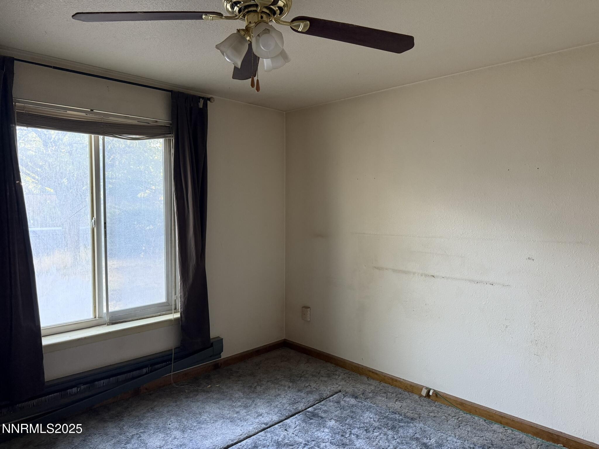 502 Prebble Street Winnemucca, NV 89445 - Photo 13 of 13 a view of an empty room and window