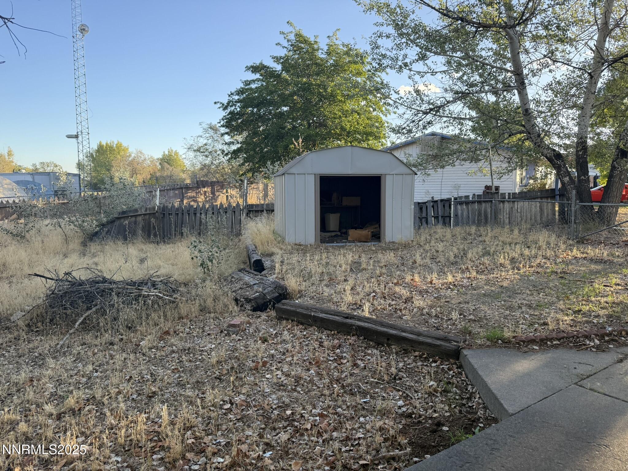 502 Prebble Street Winnemucca, NV 89445 - Photo 3 of 13 a view of a yard with wooden fence
