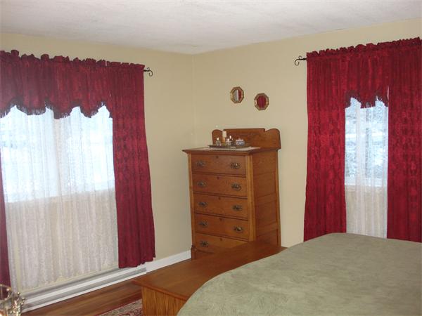499 Worcester Road Barre, MA 01005 - Photo 11 of 13 a bedroom with a bed and a window