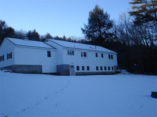 499 Worcester Road Barre, MA 01005 - Photo 3 of 13 a view of a large white house with a big yard and large trees
