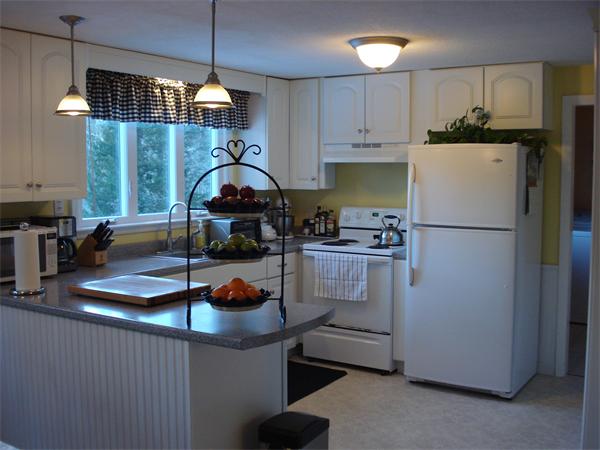 499 Worcester Road Barre, MA 01005 - Photo 5 of 13 a kitchen with refrigerator and cabinets