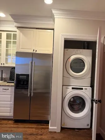 a kitchen with a washer and dryer