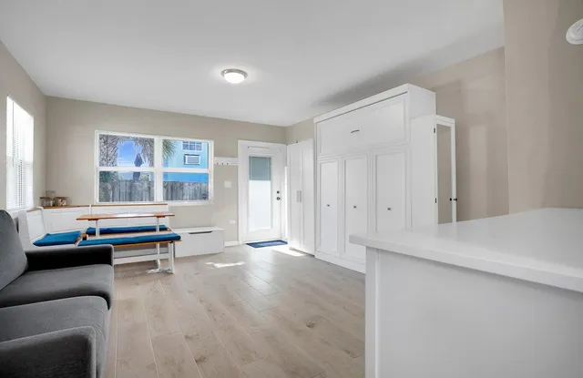 a living room with furniture and windows