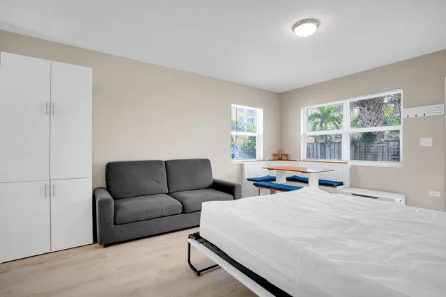 a bedroom with furniture and windows