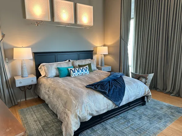 a bedroom with a bed and a dresser
