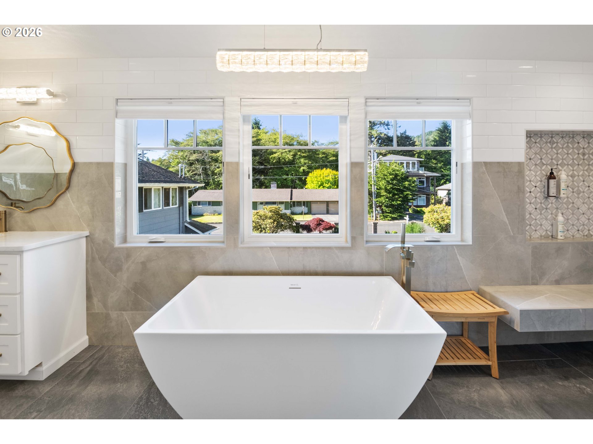 3232 Sunset Boulevard Seaside, OR 97138 - Photo 18 of 48 a bathroom with a sink a bathtub and a large window