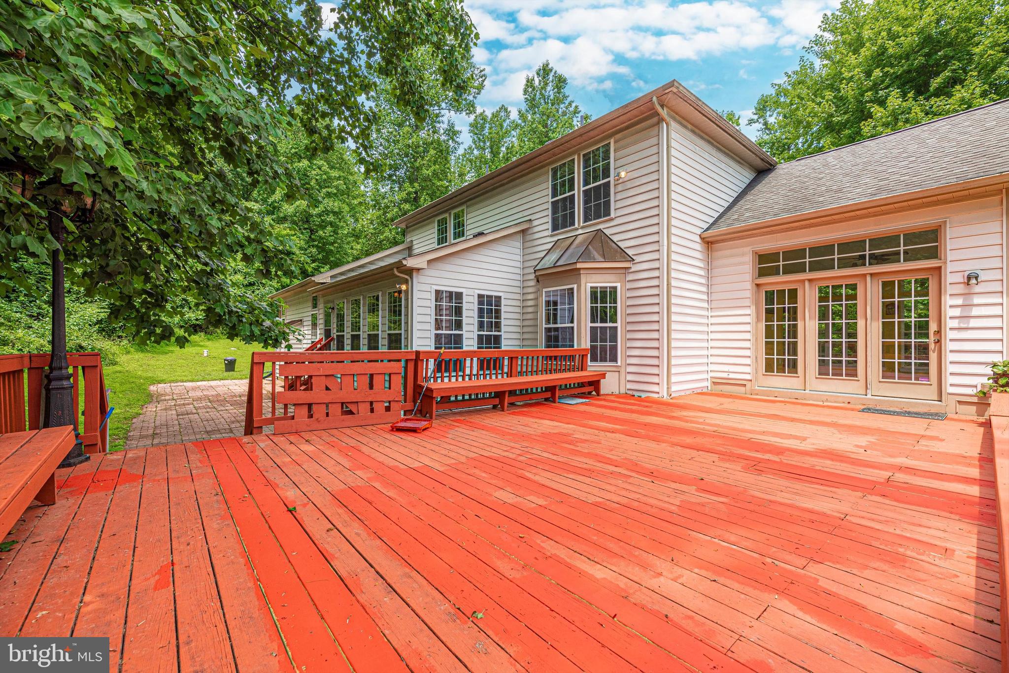 6636 South Clifton Road Frederick, MD 21703 - Photo 76 of 81 a view of a house with wooden deck and furniture