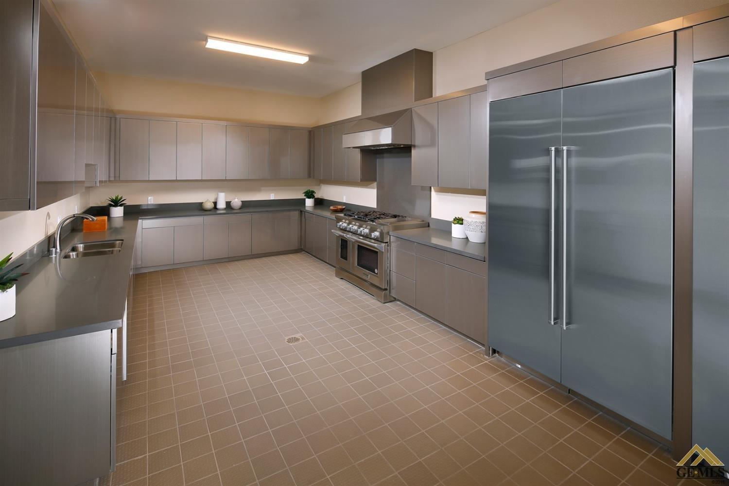 Undisclosed Address Bakersfield, CA 93311 - Photo 13 of 30 a kitchen with stainless steel appliances a refrigerator and a stove top oven