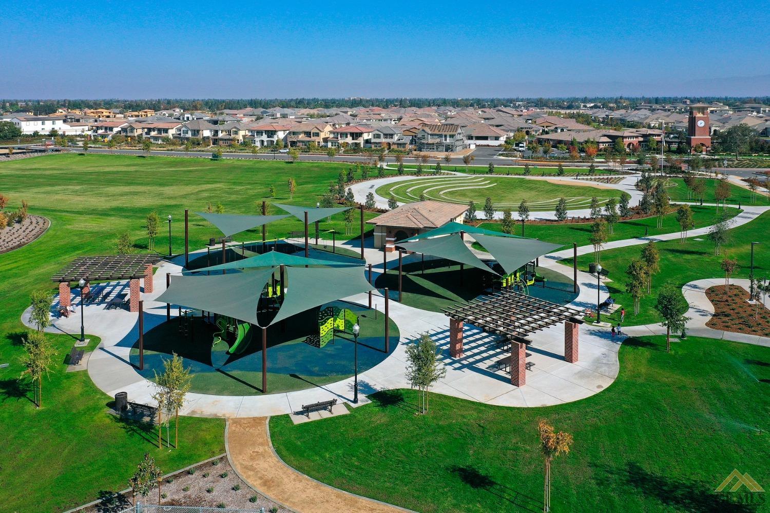 Undisclosed Address Bakersfield, CA 93311 - Photo 28 of 30 a view of a swimming pool and lounge chairs in back yard of the house