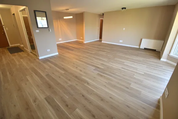 a view of a livingroom with wooden floor