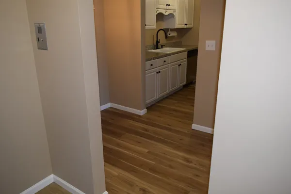 a room with a cabinets and wooden floor