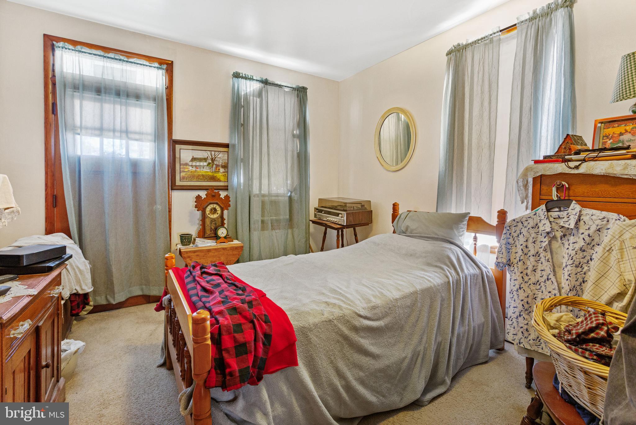 400 Linden Avenue Hanover, PA 17331 - Photo 11 of 43 a bedroom with a bed and a closet with mirror