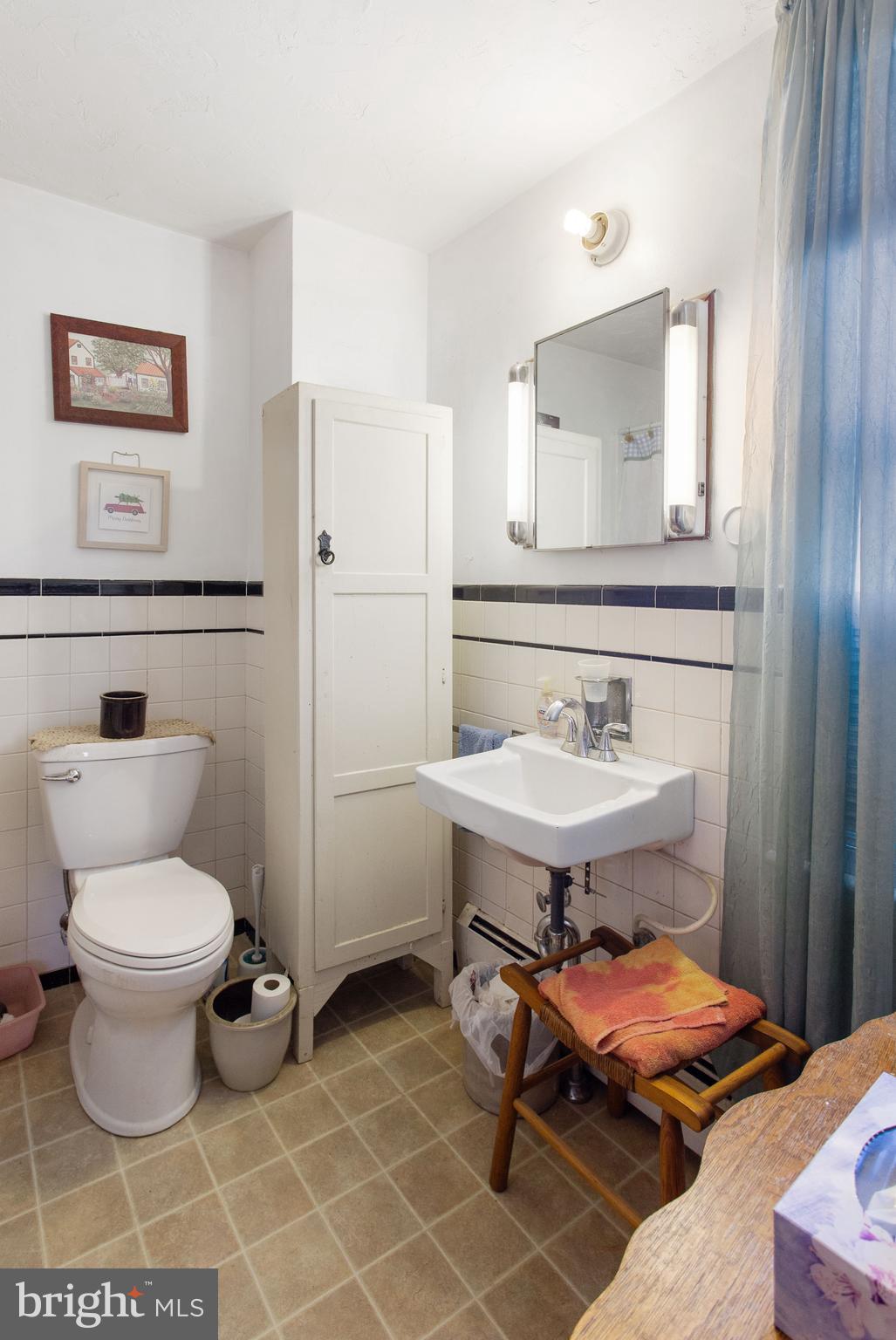 400 Linden Avenue Hanover, PA 17331 - Photo 15 of 43 a bathroom with a toilet a sink and a mirror