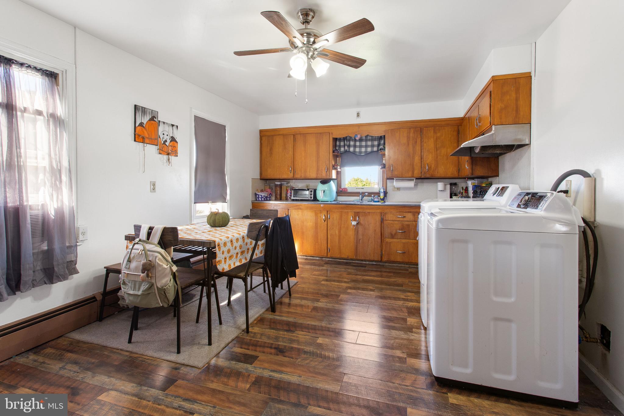 400 Linden Avenue Hanover, PA 17331 - Photo 17 of 43 a living room with furniture a dining table and a refrigerator