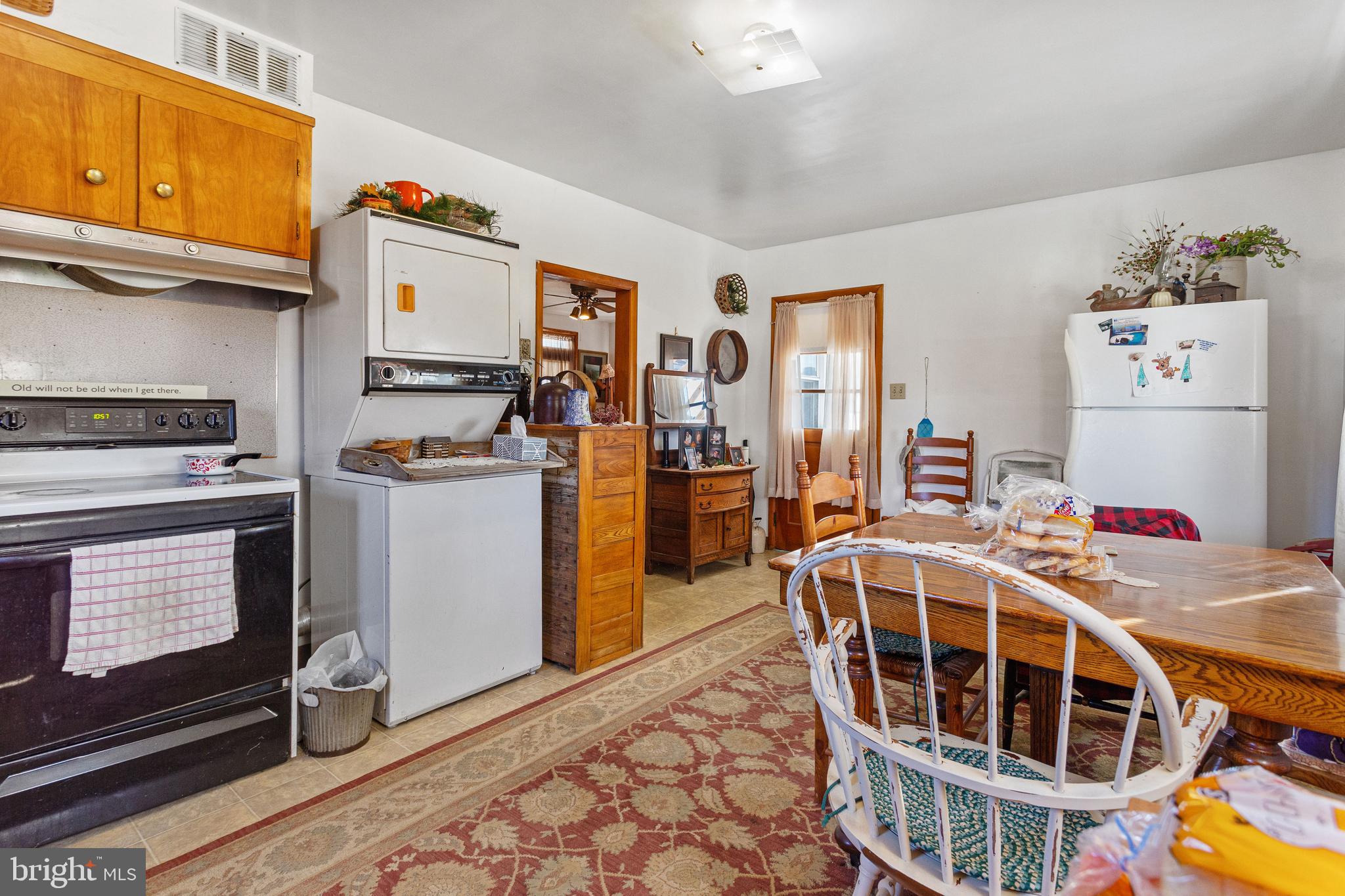 400 Linden Avenue Hanover, PA 17331 - Photo 10 of 43 a living room with furniture a flat screen tv and a stove