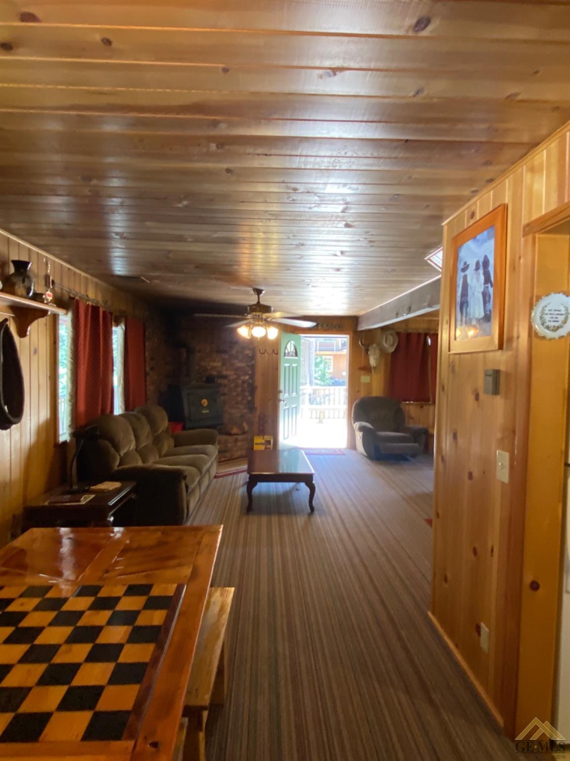 Undisclosed Address Posey, CA 93260 - Photo 14 of 20 a living room with furniture and a rug