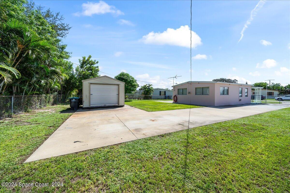 1049 Cable Lane Northeast Palm Bay, FL 32905 - Photo 15 of 24 Side View of Shed with Lots of Parking