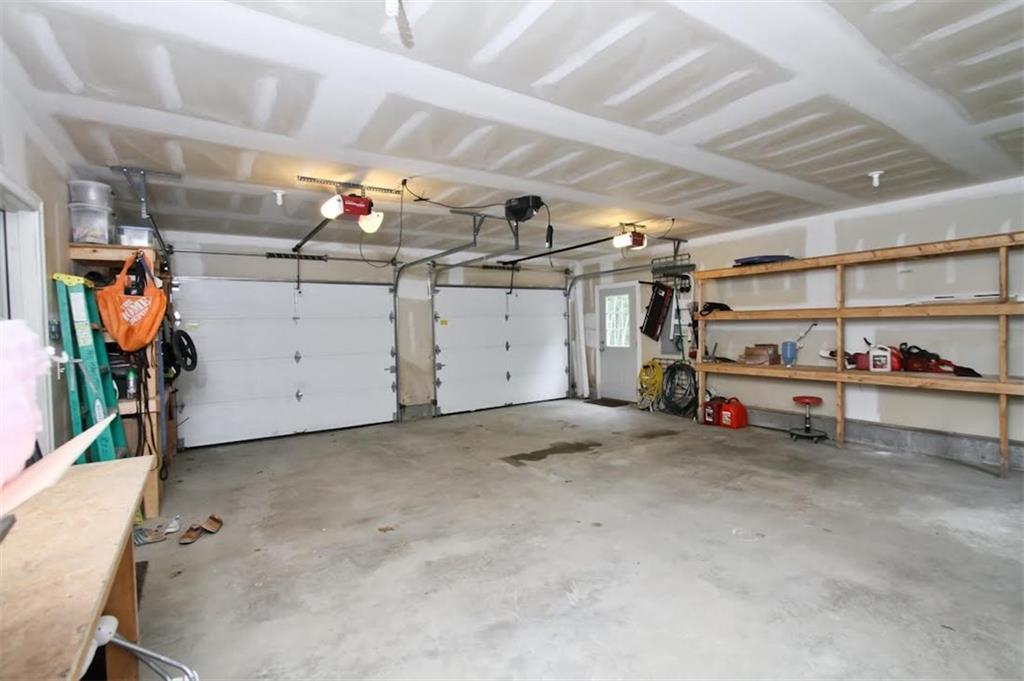 94 Sand Bar Road Windham, ME 04062 - Photo 21 of 24 Two car garage, with shelving, work...