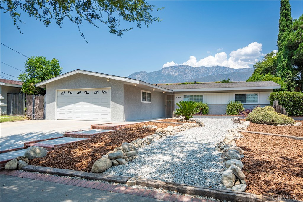 9190 Garden Street Rancho Cucamonga, CA 91701 - Photo 1 of 1 a front view of a house with garden