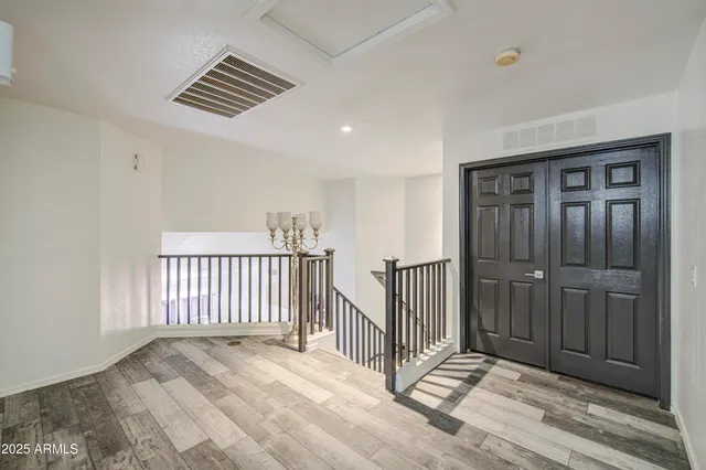 a view of a hallway with a chandelier