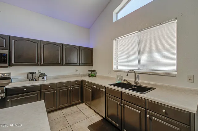 a kitchen with a sink and cabinets