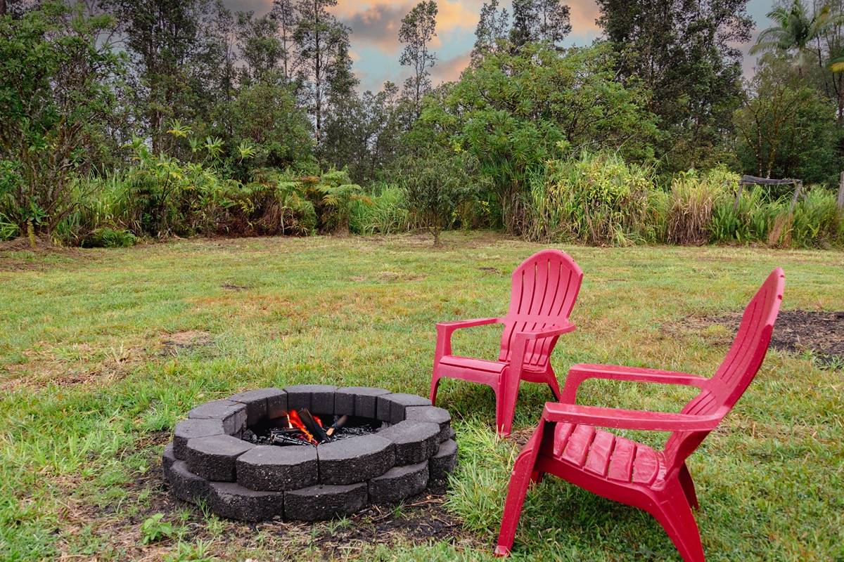 16-1404 Hopue Road Mountain View, HI 96771 - Photo 20 of 28 a outdoor space with a garden and swimming pool