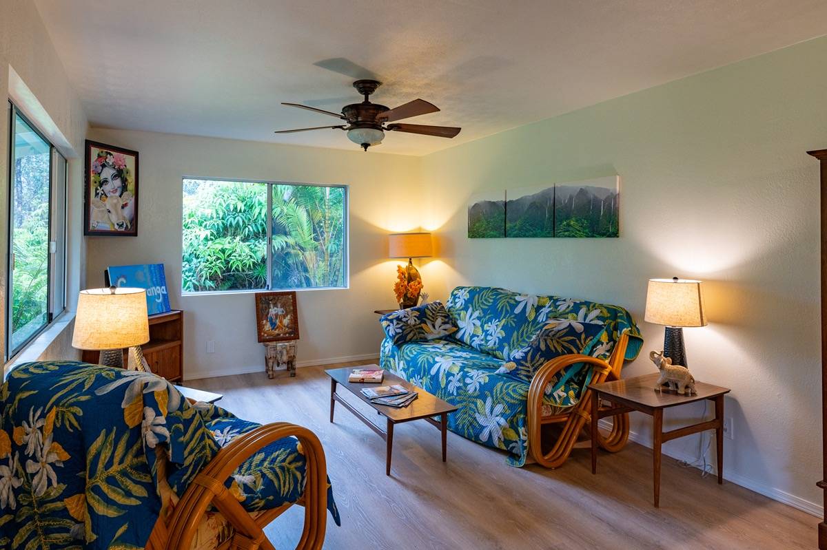 16-1404 Hopue Road Mountain View, HI 96771 - Photo 6 of 28 a living room with furniture and a lamp