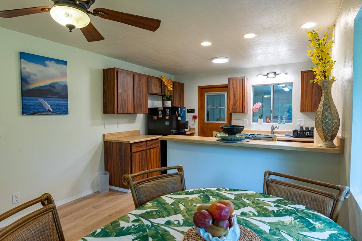 16-1404 Hopue Road Mountain View, HI 96771 - Photo 8 of 28 a kitchen with a refrigerator and a sink