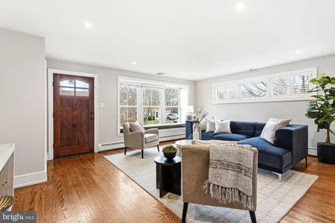 a living room with furniture and a table