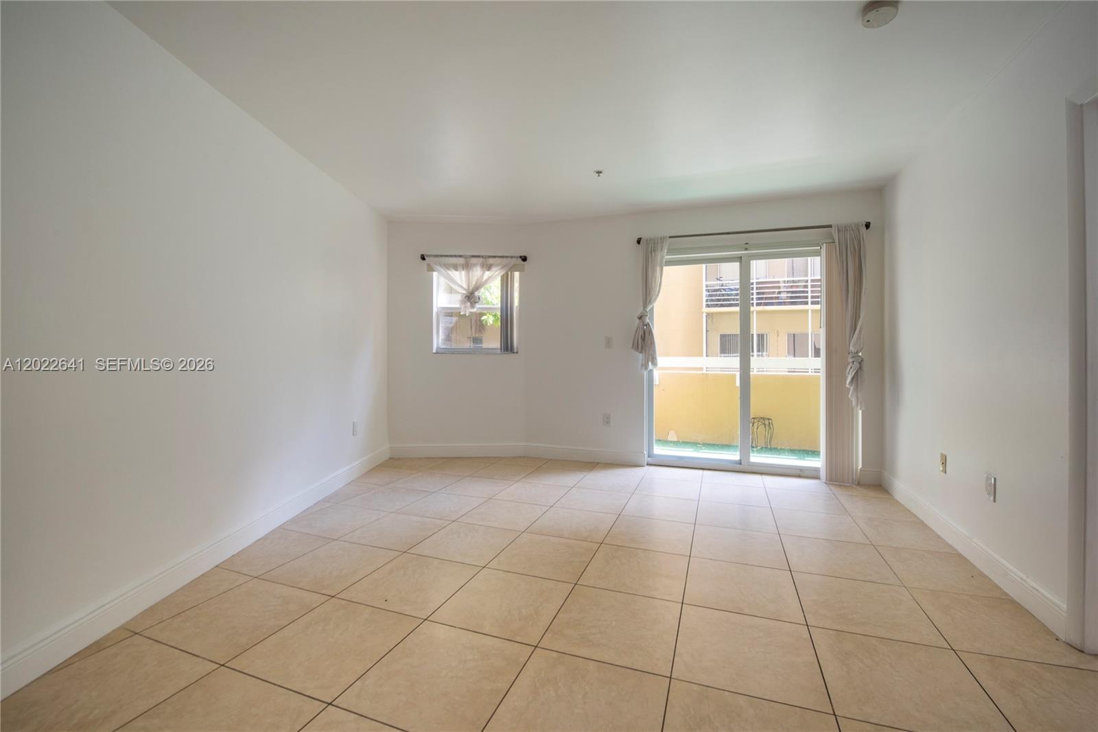4147 Stirling Road, Unit 105 Dania Beach, FL 33314 - Photo 8 of 16 an empty room with windows