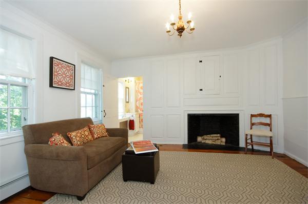 137 North Road Bedford, MA 01730 - Photo 12 of 23 a living room with furniture a fireplace and a window