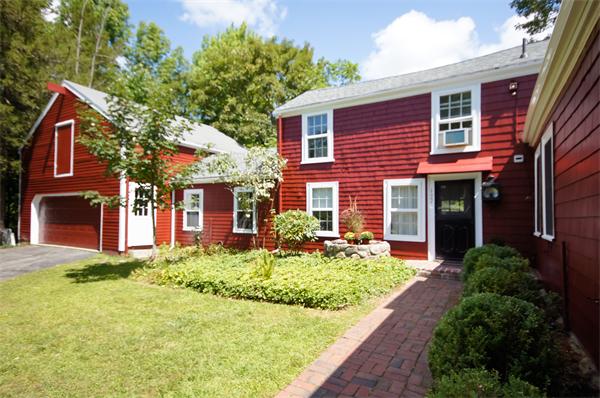 137 North Road Bedford, MA 01730 - Photo 2 of 23 a front view of a house with a yard