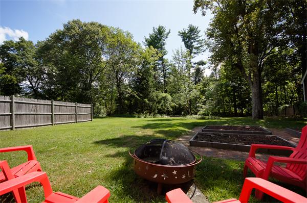 137 North Road Bedford, MA 01730 - Photo 21 of 23 a backyard of a house with lots of green space and fountain