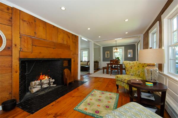 137 North Road Bedford, MA 01730 - Photo 6 of 23 a living room with furniture a fireplace and a flat screen tv