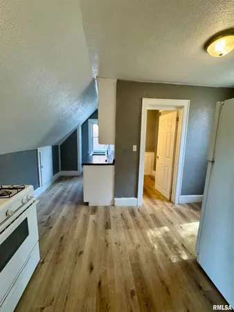 a view of a kitchen with a sink and a stove