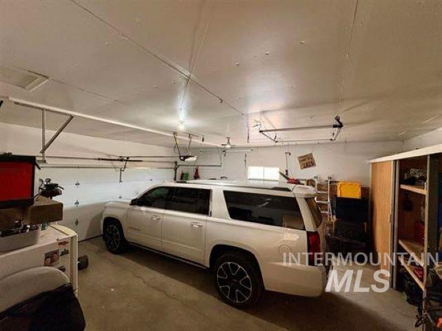 3197 Neeley Road American Falls, ID 83211 - Photo 11 of 45 Spacious garage featuring concrete flooring and exposed ceiling joists