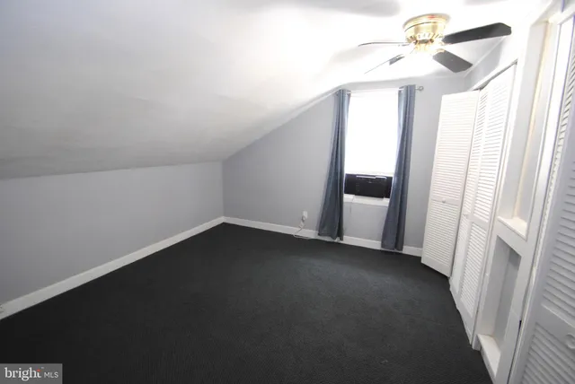 a view of a hallway with a window