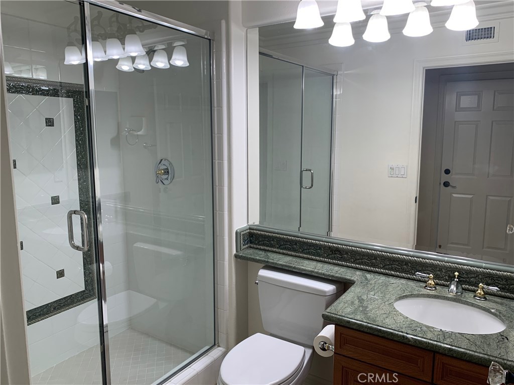 44 Whitford Irvine, CA 92602 - Photo 13 of 20 a bathroom with a granite countertop sink toilet and shower