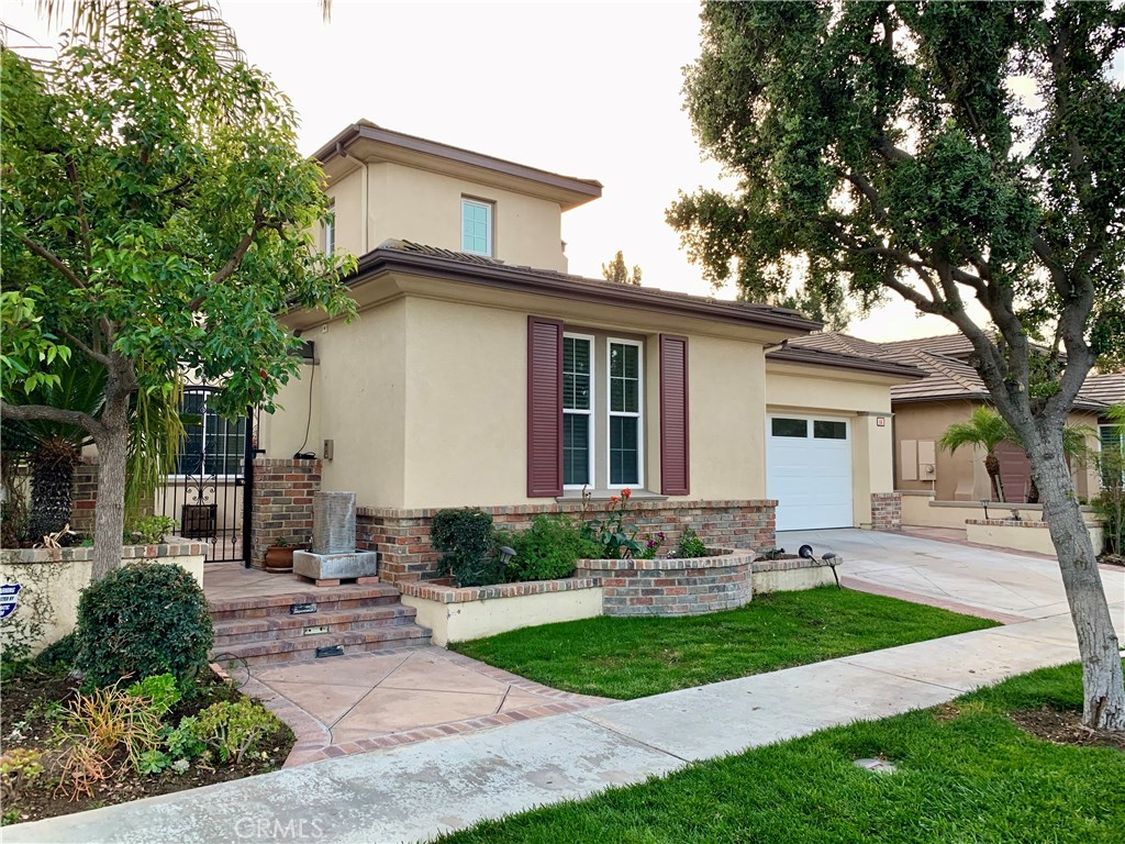 44 Whitford Irvine, CA 92602 - Photo 2 of 20 a front view of a house with a yard and potted plants