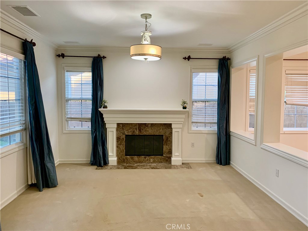 44 Whitford Irvine, CA 92602 - Photo 3 of 20 a view of an empty room with a fireplace and a window