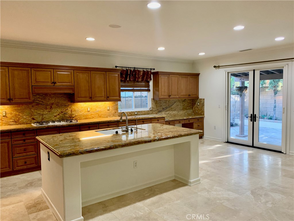 44 Whitford Irvine, CA 92602 - Photo 4 of 20 a kitchen with stainless steel appliances granite countertop a sink stove and cabinets