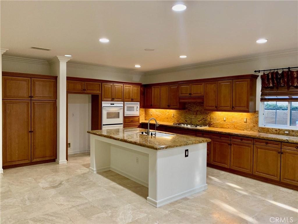 44 Whitford Irvine, CA 92602 - Photo 5 of 20 a kitchen with stainless steel appliances granite countertop a sink and stove top oven