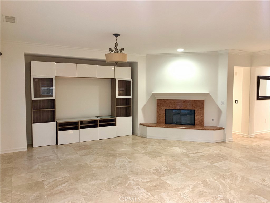 44 Whitford Irvine, CA 92602 - Photo 7 of 20 a view of a room with a fireplace cabinet and window
