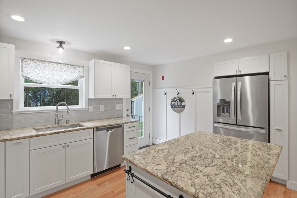 29 Stuart Road Rochester, MA 02770 - Photo 12 of 41 a kitchen with stainless steel appliances granite countertop sink refrigerator and cabinets