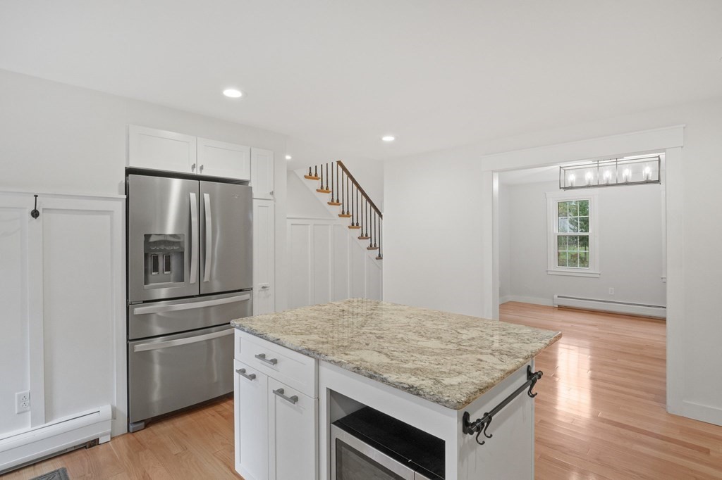 29 Stuart Road Rochester, MA 02770 - Photo 14 of 41 a kitchen with a stove and a refrigerator