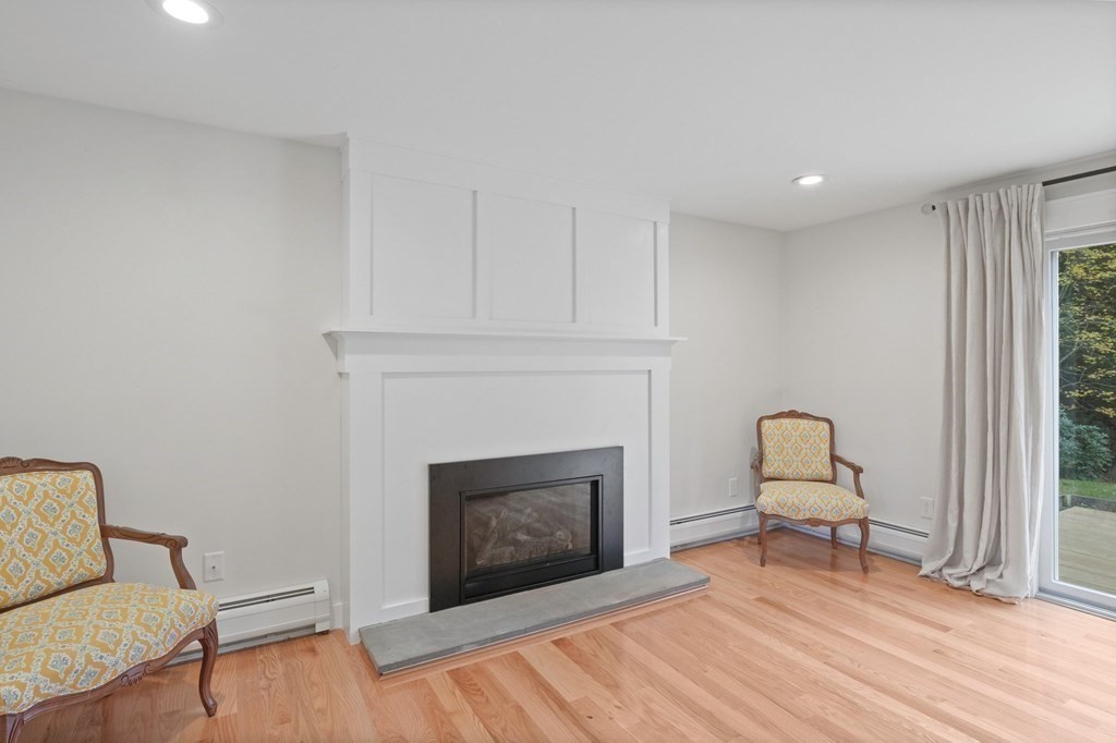 29 Stuart Road Rochester, MA 02770 - Photo 15 of 41 a living room with furniture and a fireplace