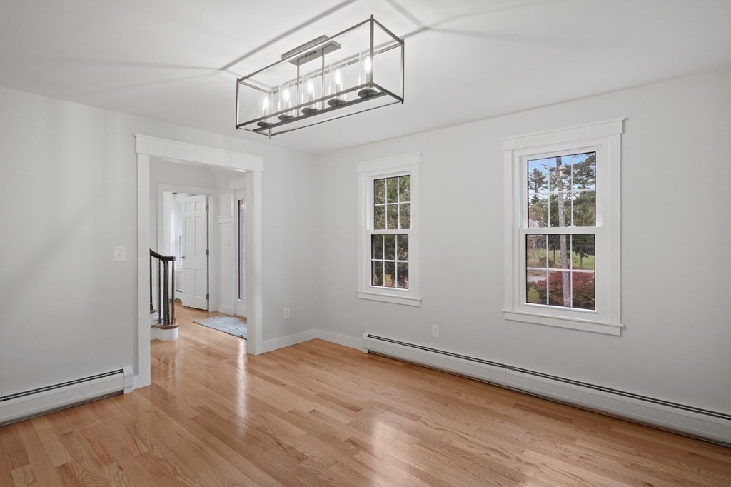 29 Stuart Road Rochester, MA 02770 - Photo 22 of 41 an empty room with wooden floor and windows