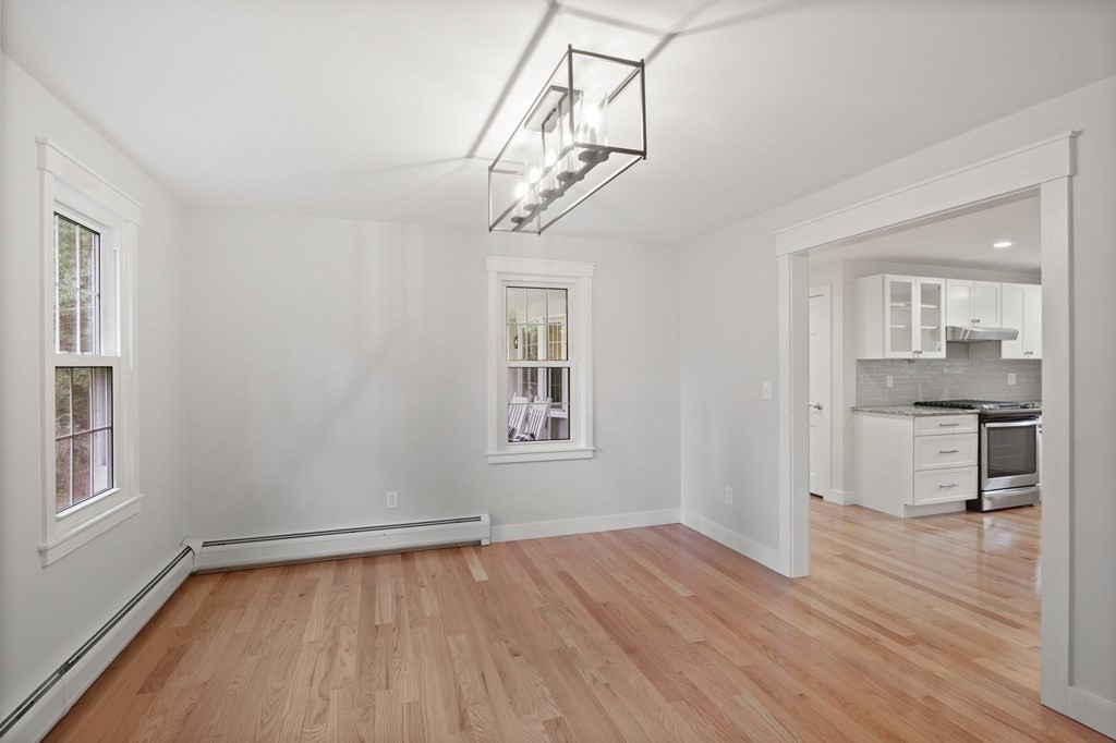 29 Stuart Road Rochester, MA 02770 - Photo 23 of 41 wooden floor in an empty room with a window