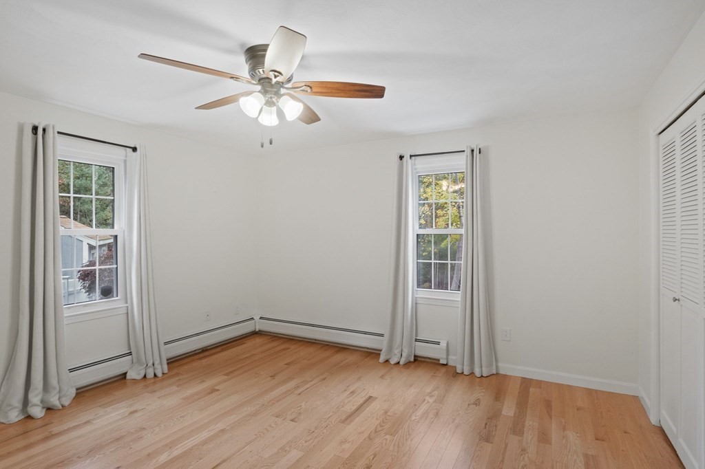 29 Stuart Road Rochester, MA 02770 - Photo 26 of 41 wooden floor in an empty room with a window